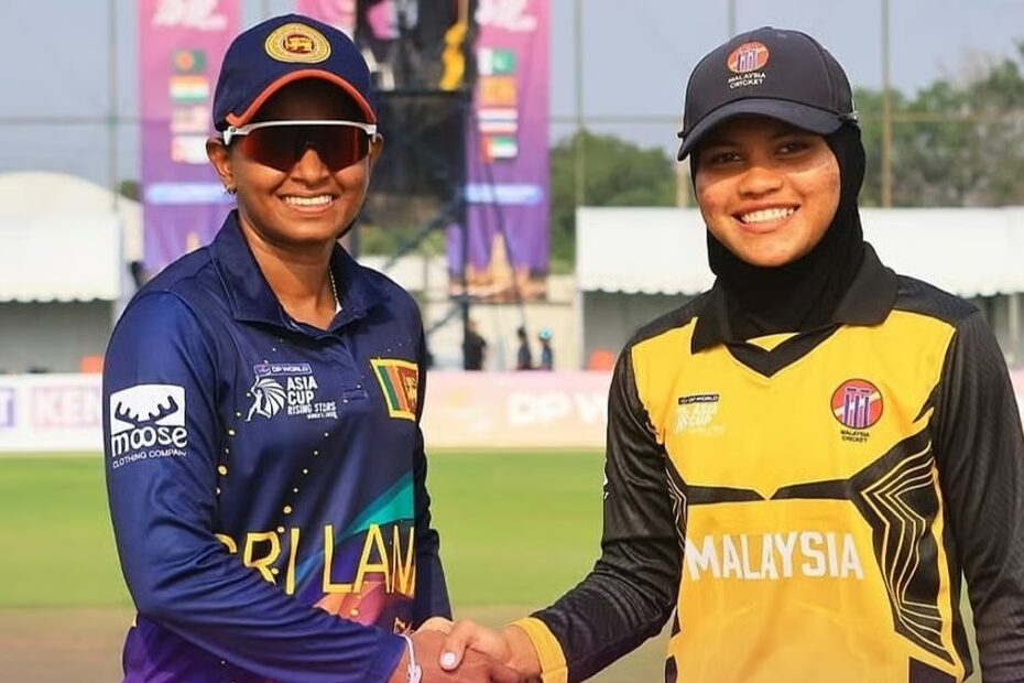 Malaysia Women vs Sri Lanka Women 3rd Quarter-Final Two female cricketers shake hands on a cricket pitch; one wearing a blue Sri Lanka kit, the other in a yellow Malaysia kit. Indibet Betting and Casino